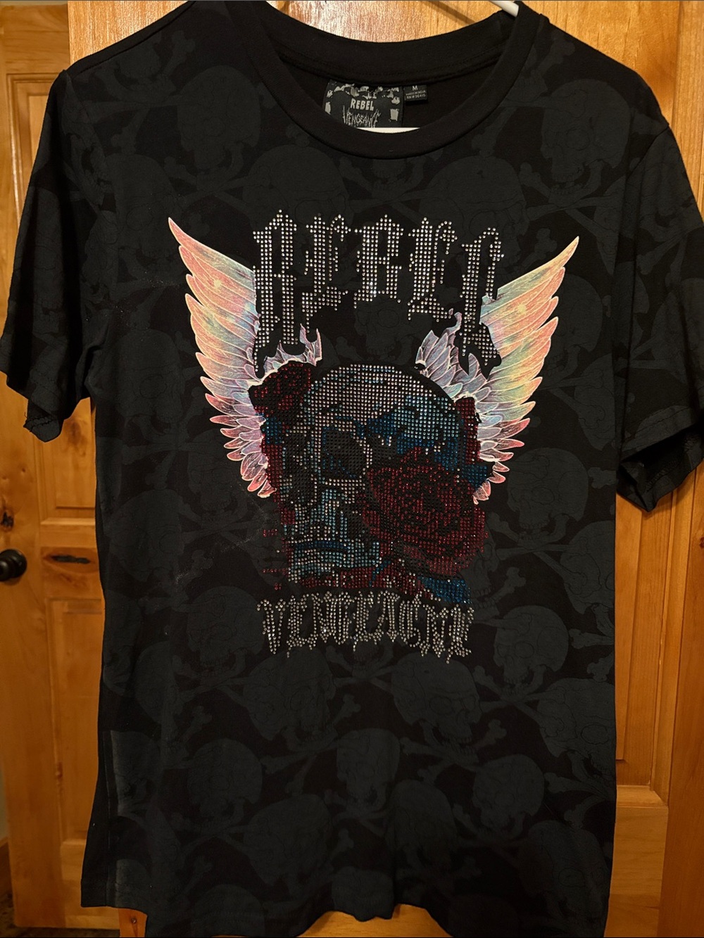 rebels Black Tee with Iridescent Pastel Wings and Red Rose Skull Graphic